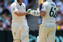 MELBOURNE, AUSTRALIA - DECEMBER 27: Australian batsman Travis Head of Australia and Tim Paine of Australia congratulate each other for making 100 runs during day two of the Second Test match in the series between Australia and New Zealand at The Melbourne Cricket Ground on December 27, 2019 in Melbourne, Australia. (Photo by Speed Media/Icon Sportswire)
