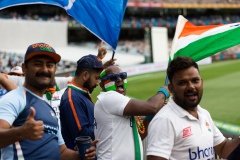 MELBOURNE, AUSTRALIA - DECEMBER 27: Indian fans with face paint can be seen cheering and waving flags during day two of the Second Vodafone Test cricket match between Australia and India at the Melbourne Cricket Ground on December 27, 2020 in Melbourne, Australia. (Photo by Dave Hewison/Speed Media/Icon Sportswire)