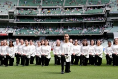 MELBOURNE, AUSTRALIA - DECEMBER 26: Qantas singers kneel before performing during the Boxing Day Test Match between Australia and South Africa at The Melbourne Cricket Ground on December 26, 2022 in Melbourne, Australia. (Photo by Dave Hewison/Speed Media/Icon Sportswire)