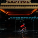A bicyclist is seen braving the rain in Swanston Street during COVID-19 in Melbourne, Australia. Victoria has recorded 14 COVID related deaths including a 20 year old, marking the youngest to die from Coronavirus in Australia, and an additional 372 new cases overnight.
