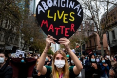MELBOURNE, AUSTRALIA - JUNE 06: Masked protesters holding placards march through the CBD during a Black Lives Mater rally on 06 June, 2020 in Melbourne, Australia. This event was organised to rally against aboriginal deaths in custody in Australia as well as in unity with protests across the United States following the killing of an unarmed black man George Floyd at the hands of a police officer in Minneapolis, Minnesota. (Photo by Speed Media/Icon Sportswire)
