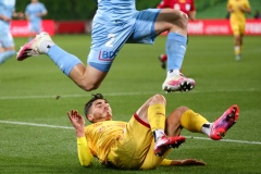 MELBOURNE, AUSTRALIA - MAY 13: Joshua Cavallo of Adelaide United takes a fall as Scott Galloway of Melbourne City controls the ball during the Hyundai A-League soccer match between Melbourne City FC and Adelaide United on May 13, 2021 at AAMI Park in Melbourne, Australia. (Photo by Speed Media/Icon Sportswire)